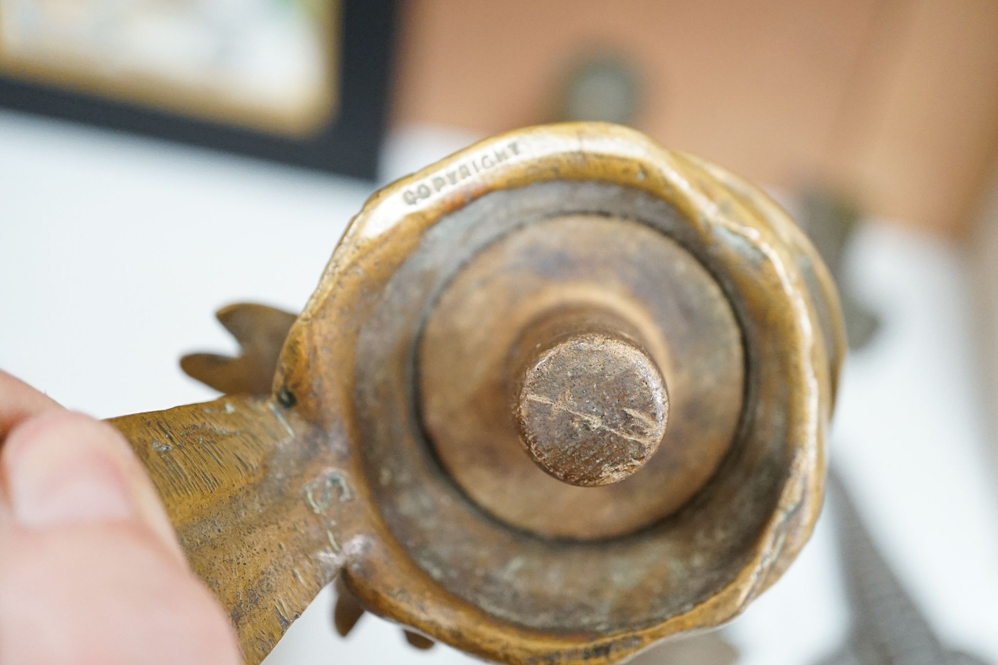 A Bruce Bainsfather Cast brass bottle stopper, 13cm, WMF cruet stand and 7 other items